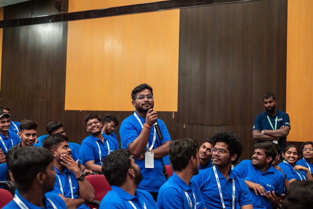 Student volunteers seated together in the auditorium during a REEV technical session at GITAM University