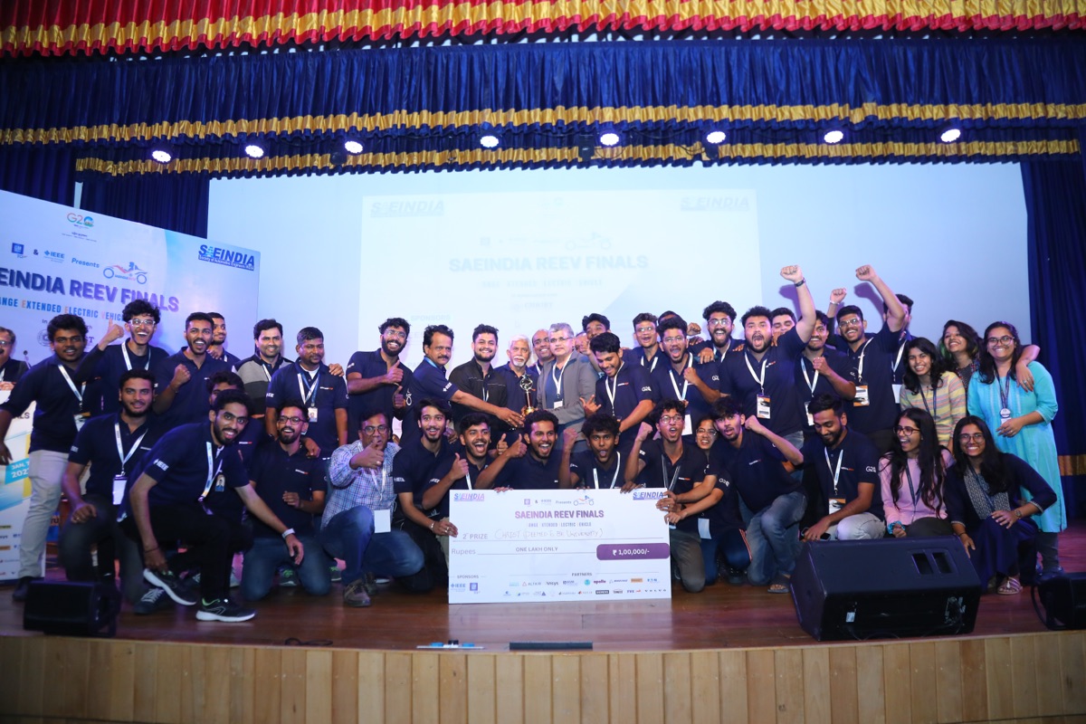 REEV team celebrating on stage after finishing 1st Runner-up at the REEV SAEINDIA Finals, Christ University