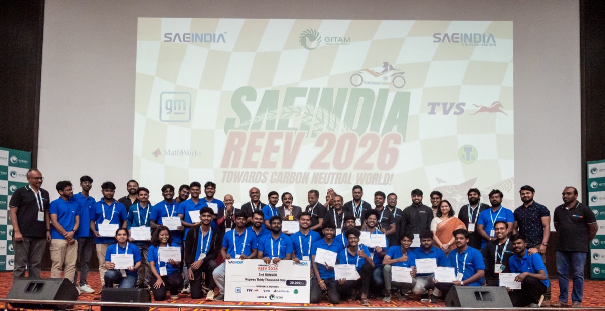 REEV 2026 team and organizing committee on stage at GITAM University celebrating a 2nd Runner-up finish